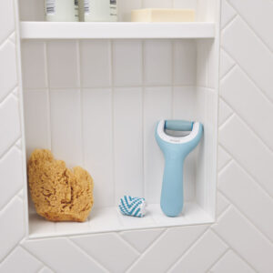 Blue amope electronic foot file placed in a bathroom shelf