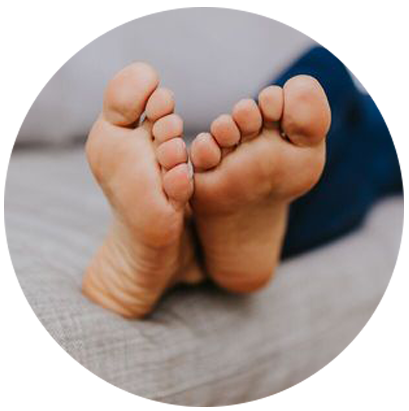 Image of feet on sofa