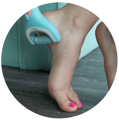 Amope electronic foot file being used on foot