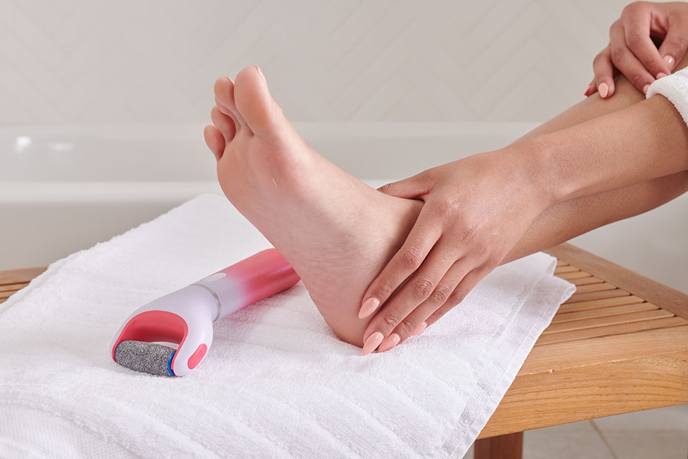 Image of hand touching heel after using electronic foot file
