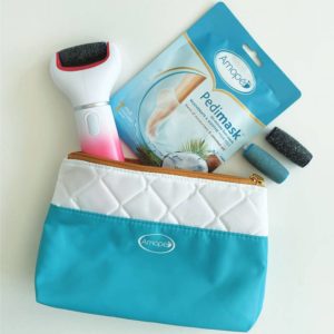 image of kit contents: Pedi Perfect Advanced Electronic Foot File, 2 roller heads, Coconut Oil Pedimask, storage bag